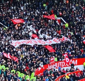 Liverpool fans celebrate their Champions League success at Old Trafford